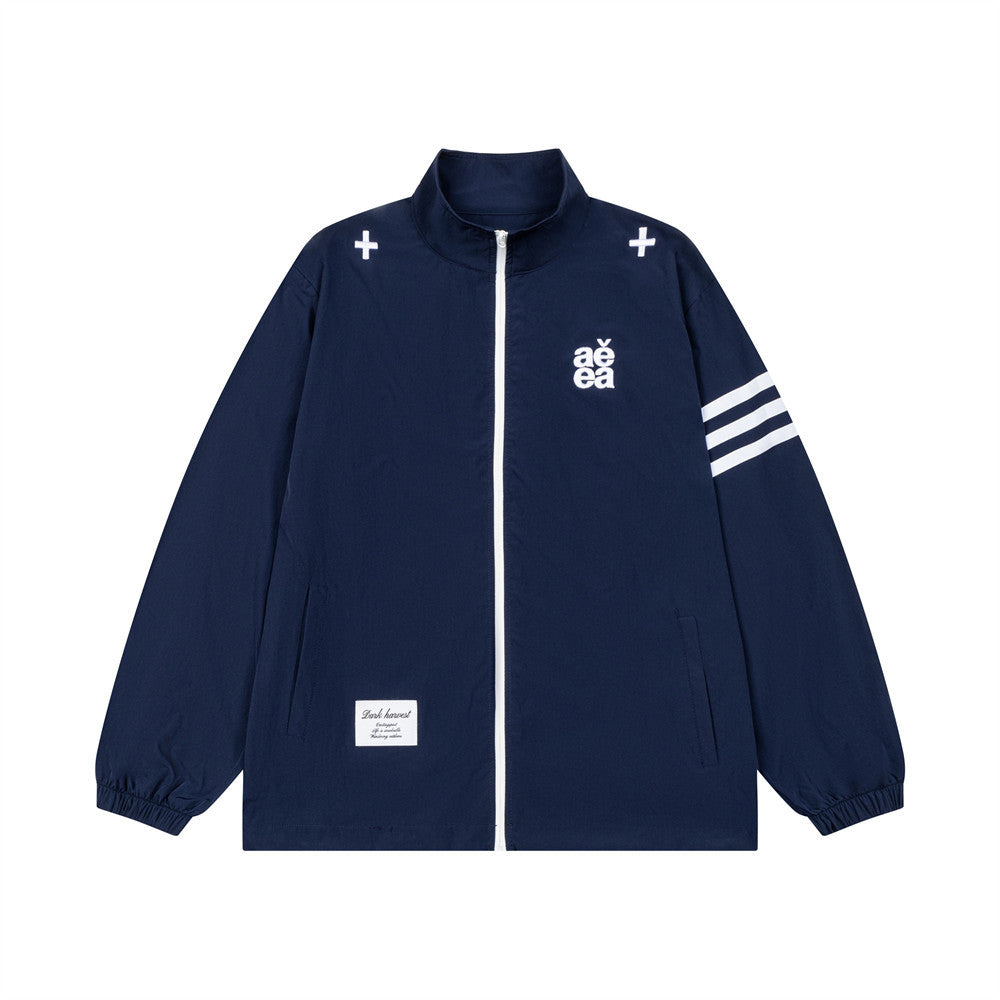 AEEA oversized stand collar track jacket in navy blue with three white stripe sleeves and logo embroidery