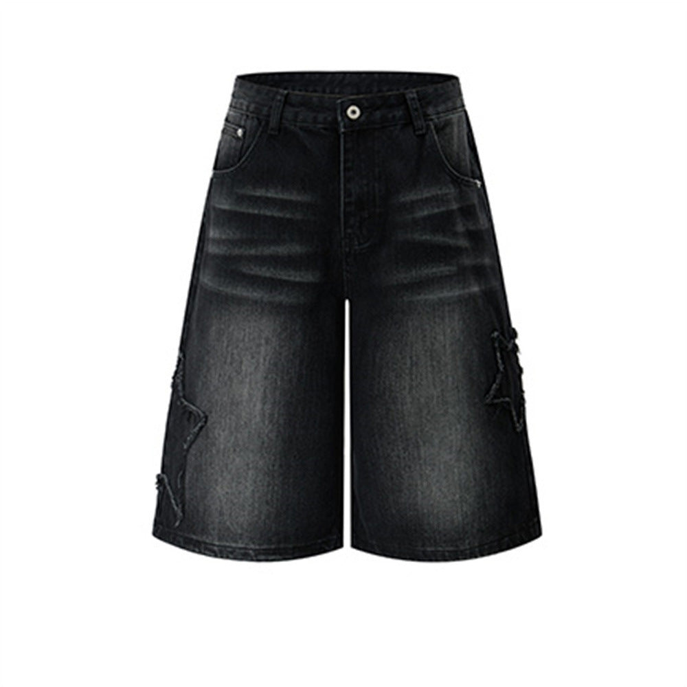 Men's baggy washed denim shorts with raw-edge five-pointed star patch appliqués on outer legs, wide-leg knee-length cut in fa