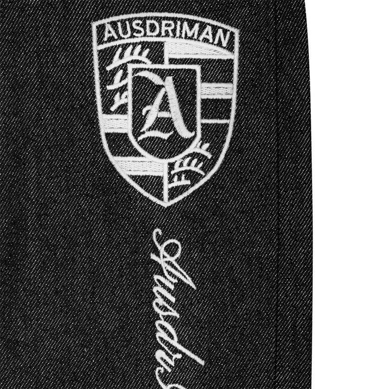 Jean homme à jambes larges avec broderie de badge et empiècements patchwork déconstruits