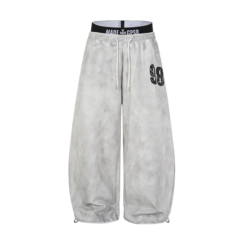 Acid wash wide-leg sweatpants in light grey with double waistband and distressed 98 graphic, front view