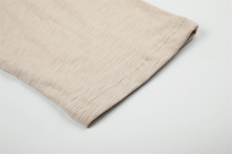 Beige long sleeve tee cuff hem with neat stitched edge detail