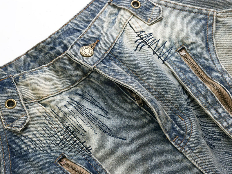 Baggy Wide-Leg Jeans – Chaotic Embroidery, Distressed Denim & Arc-Hem Design