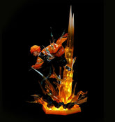 The Rengoku Kyojuro Demon Slayer Flame Hashira Figure features vibrant orange hair and dynamic poses, with translucent fiery orange and yellow shapes. The high-quality 350mm PVC figure by Demon Slayer includes a light-up base and eyes, contrasting against the stark black background.