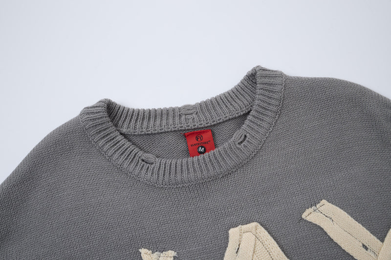 Pull col rond oversize en maille usée avec motif de lettres appliquées