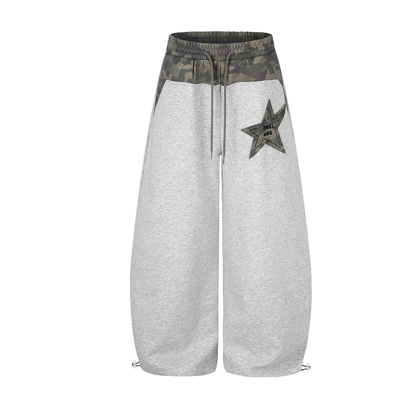 Wide-leg sweatpants with camouflage waistband and star patch appliqué in light grey, front view