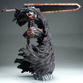 The Berserk Guts L Version PVC figure by Berserk features battle-damaged, bloodstained black armor with red accents and a tattered cloak effect. It wields a large dark sword against a plain gray background.