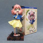 The Seakoff 18cm PVC Anya Forger Dancing Figure from Spy x Family features a cheerful, pink-haired girl in a blue shirt and yellow skirt on a record player platform. The box showcases music notes and "SPY x FAMILY" with "Anya," making it perfect for any anime figure collection. Limited edition!.