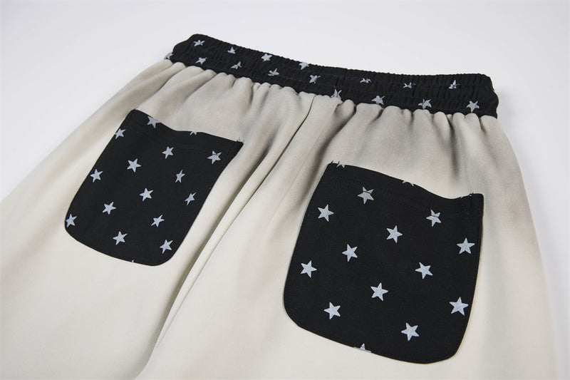 Pantalon de survêtement à jambes larges motif baroque – Imprimé usé, ceinture à étoiles