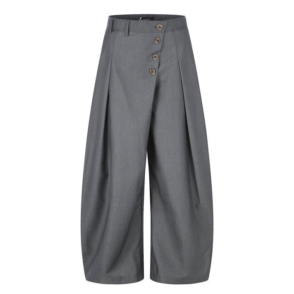 Wide-leg pleated trousers with diagonal button fly in grey, front view
