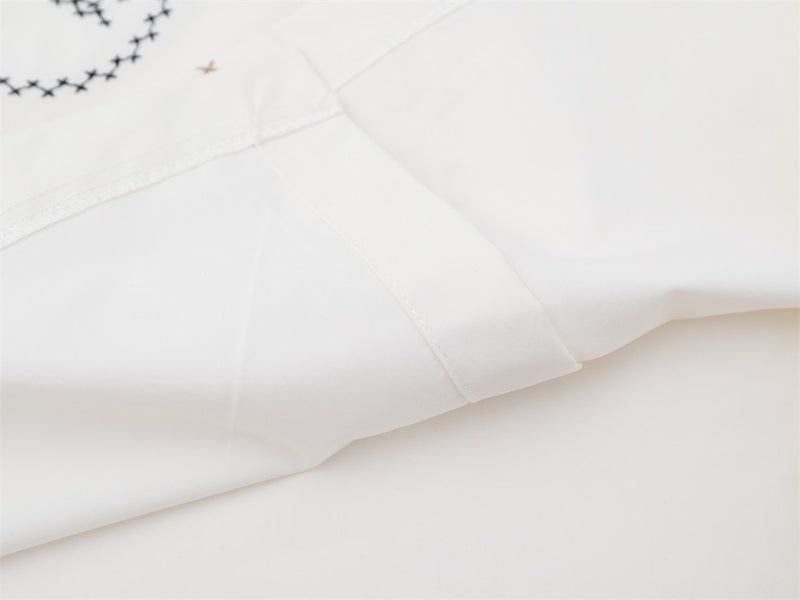 Abstract Face Embroidered Oversized Short-Sleeve Button-Up Shirt