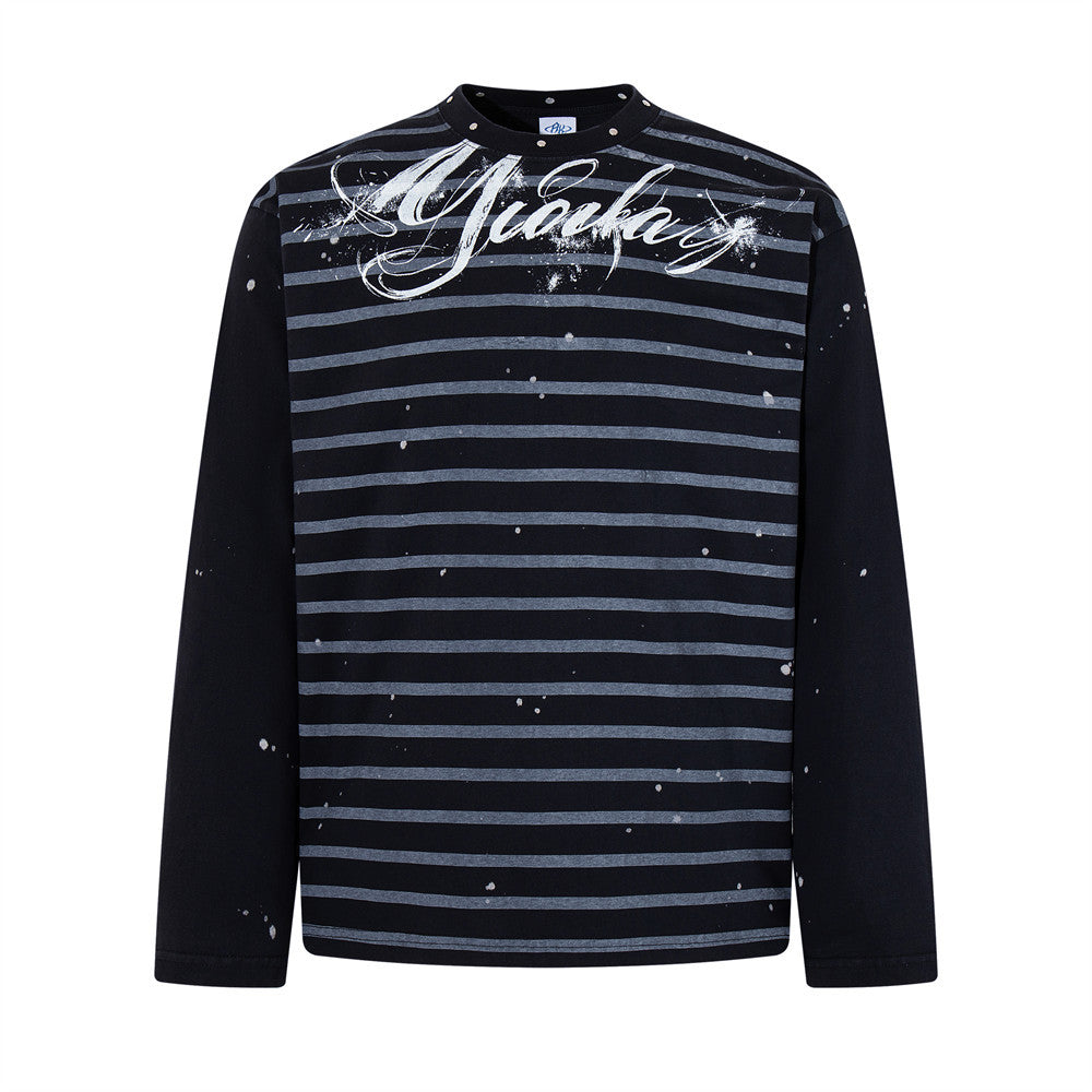 Oversized men's long-sleeve striped tee with paint-splatter detailing and script logo graphic in black colorway, front view