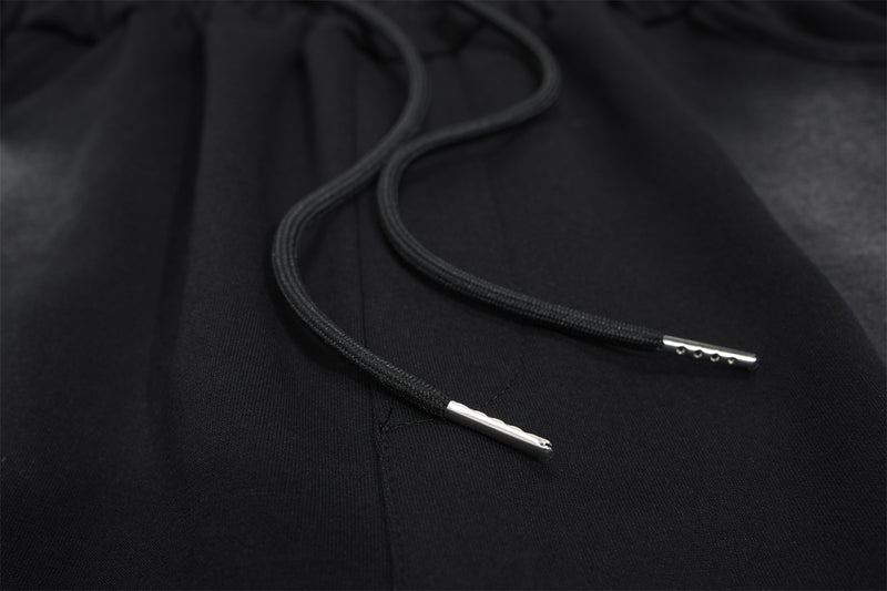 Pantalon de survêtement à jambes larges avec croix gothique et finition délavée