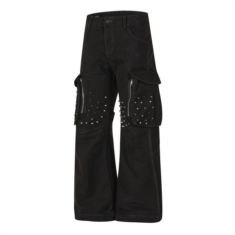 Angled front view of black cargo pants showing studded side pockets and wide-leg fit