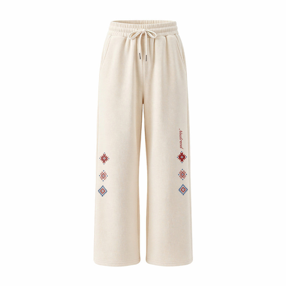 Men's wide-leg sweatpants with Aztec geometric embroidered motifs in almond and navy colorways