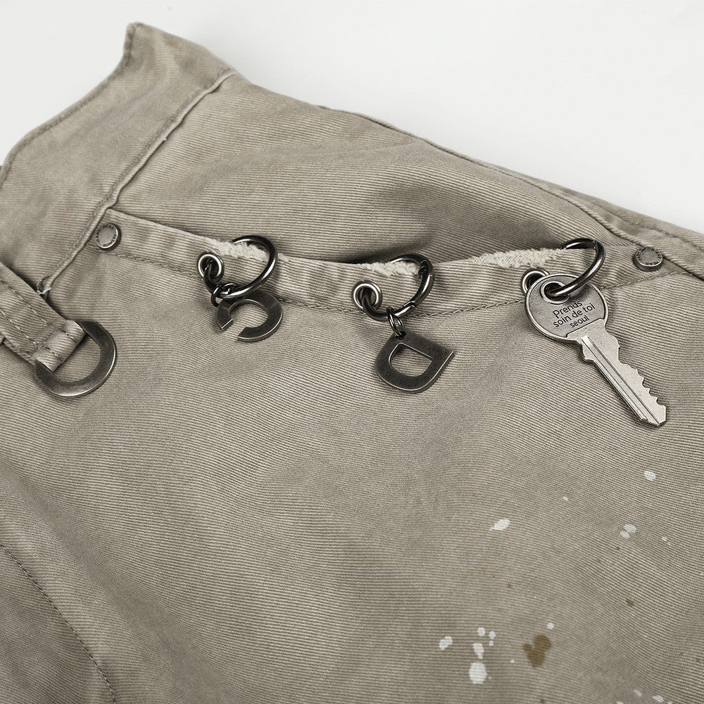 Pantalon cargo wide leg – Kaki délavé, éclaboussures de peinture et chaîne métallique