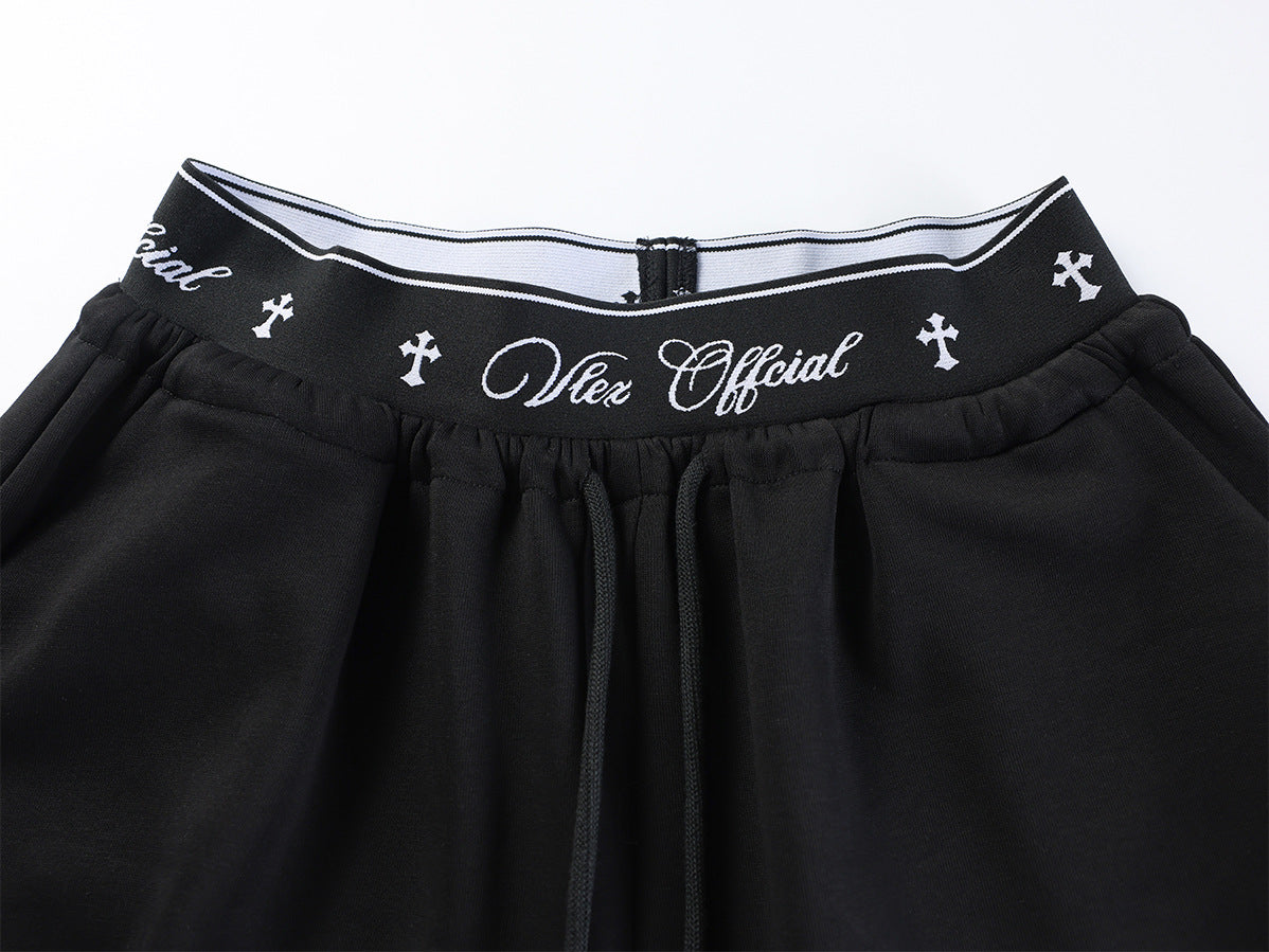 Pantalon de survêtement à jambes larges avec logo cursif et ceinture élastiquée