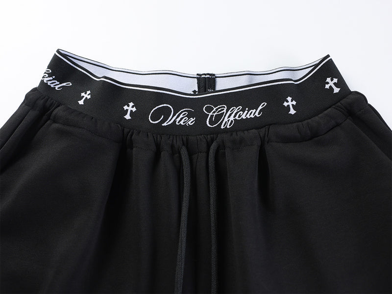 Pantalon de survêtement à jambes larges avec logo cursif et ceinture élastiquée