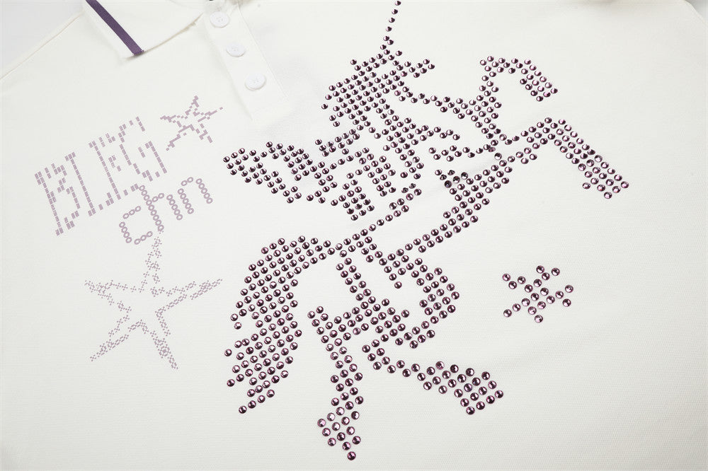 Close-up of front chest graphic on white polo shirt with rhinestone horse and star design