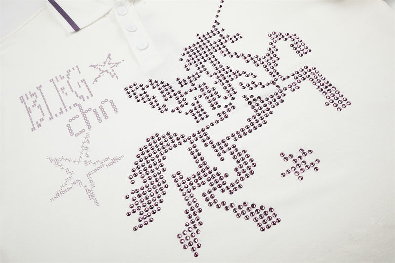 Close-up of front chest graphic on white polo shirt with rhinestone horse and star design