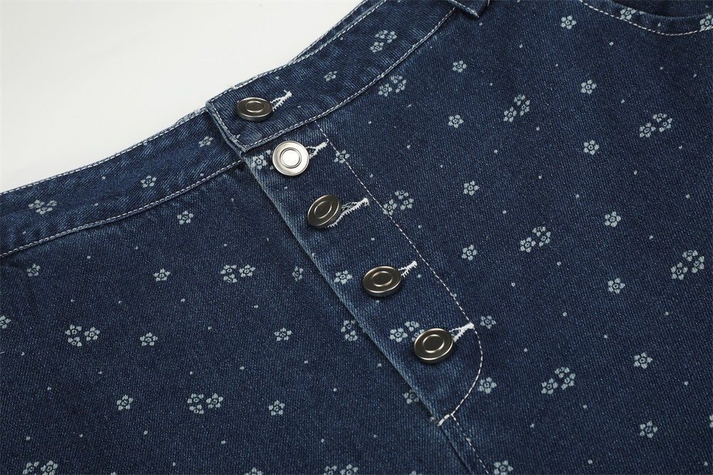 Close-up of the front waistband and five-button fly on dark blue floral print jeans