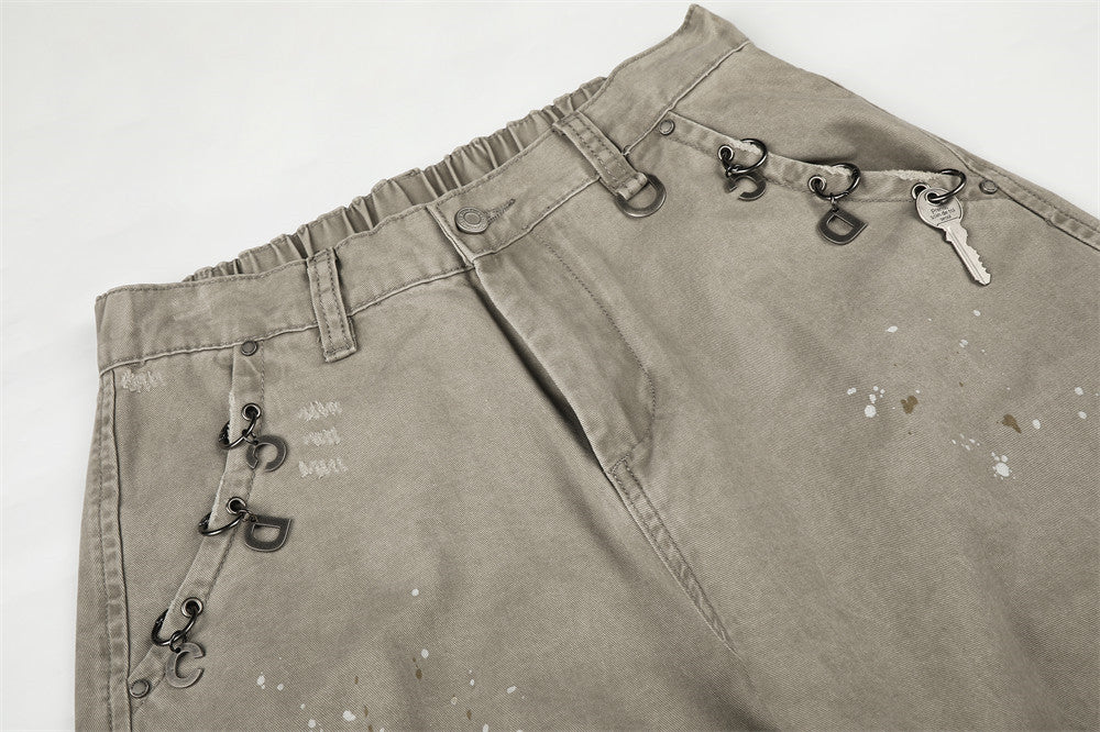 Pantalon cargo wide leg – Kaki délavé, éclaboussures de peinture et chaîne métallique