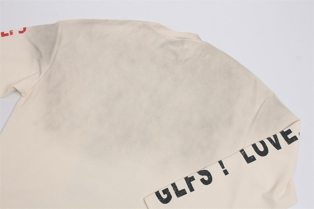 Herren-Langarmshirt aus Waffelstrick mit Grafik – „Loneliness Broken Reality“-Print
