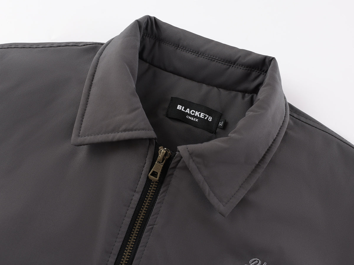 Veste bomber matelassée pour homme avec col à pointes et coutures arrondies