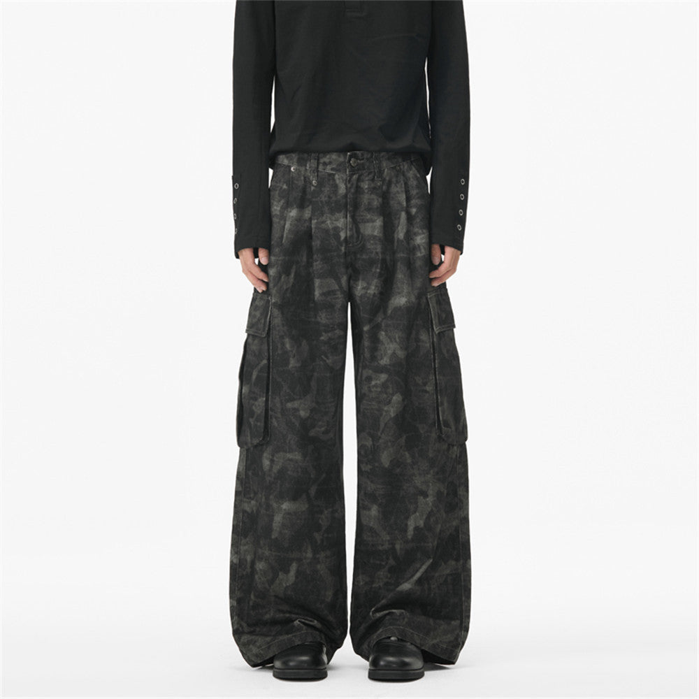 Men's baggy wide-leg tie-dye camouflage cargo pants in dark charcoal grey with multi-pocket utility design