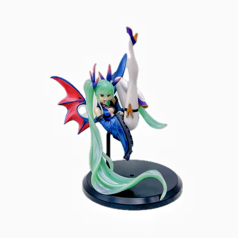 The Hatsune Miku Light &amp; Dark 17cm PVC Figure showcases her in a blue dress, long green hair, and striking red and blue bat wings. She sits gracefully with one leg raised on a black stand, blending angelic and demonic elements.