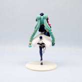 This Hatsune Miku Panda-themed 18cm PVC figure features long teal pigtails and a white and navy blue outfit with pink accents. Elegantly posed on one foot, with one arm up and the other down, it stands on a round white base, capturing an artistic back view. A charming collectible with box.