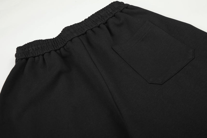 Pantalon de survêtement à jambes larges avec écusson licorne et imprimé graffiti – Streetwear noir