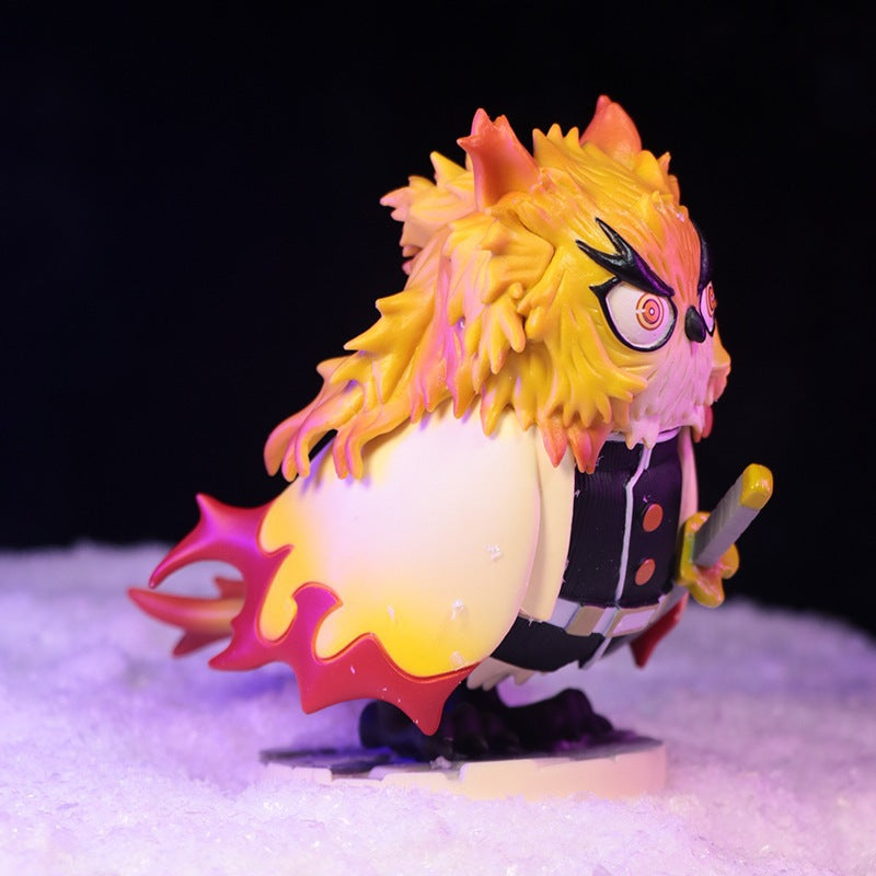 The 11.5cm Owl Cosplay Flame Hashira (Kyojuro Rengoku) Figure by Demon Slayer features an owl-like face, spiky yellow and red feathers, and a suit resembling the anime&