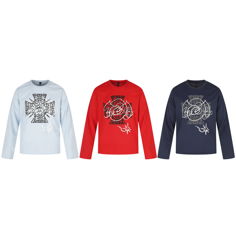Three long sleeve crew neck tees in light blue, red, and navy with Celtic cross graphic print