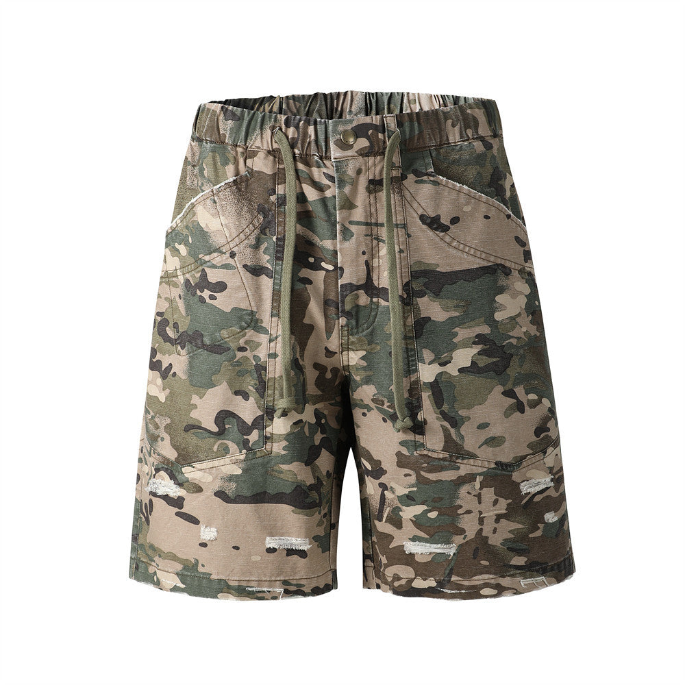 Green camouflage cargo shorts with drawstring waist and distressed front view