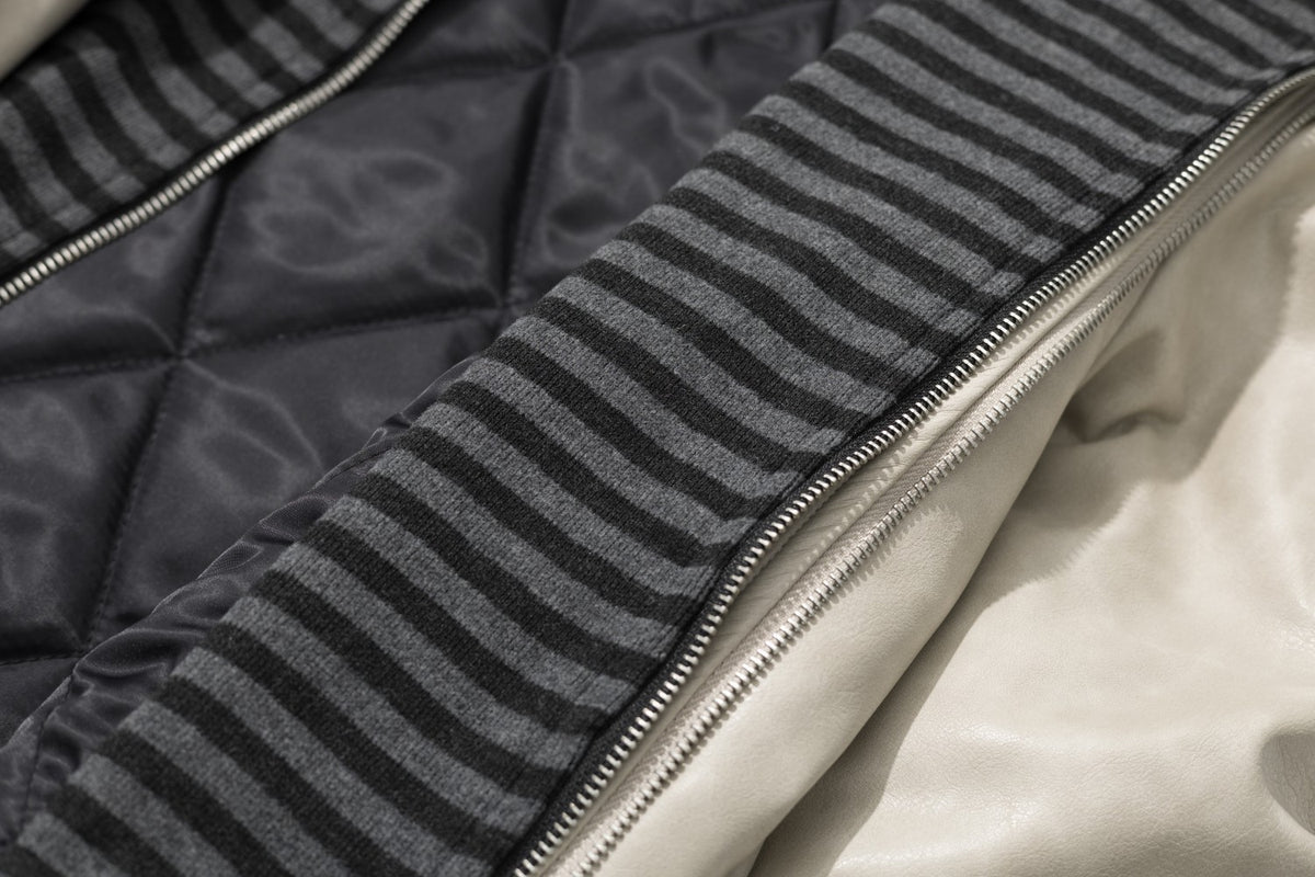 Veste matelassée en similicuir avec col en fausse fourrure et boutons croisés