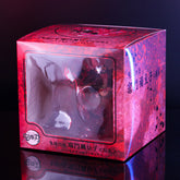 The Demon Slayer Nezuko Explosion Pose figure is showcased in a red and black decorative box with floral patterns and Japanese text, featuring a clear window for partial visibility against a dark background—perfect for any collection.