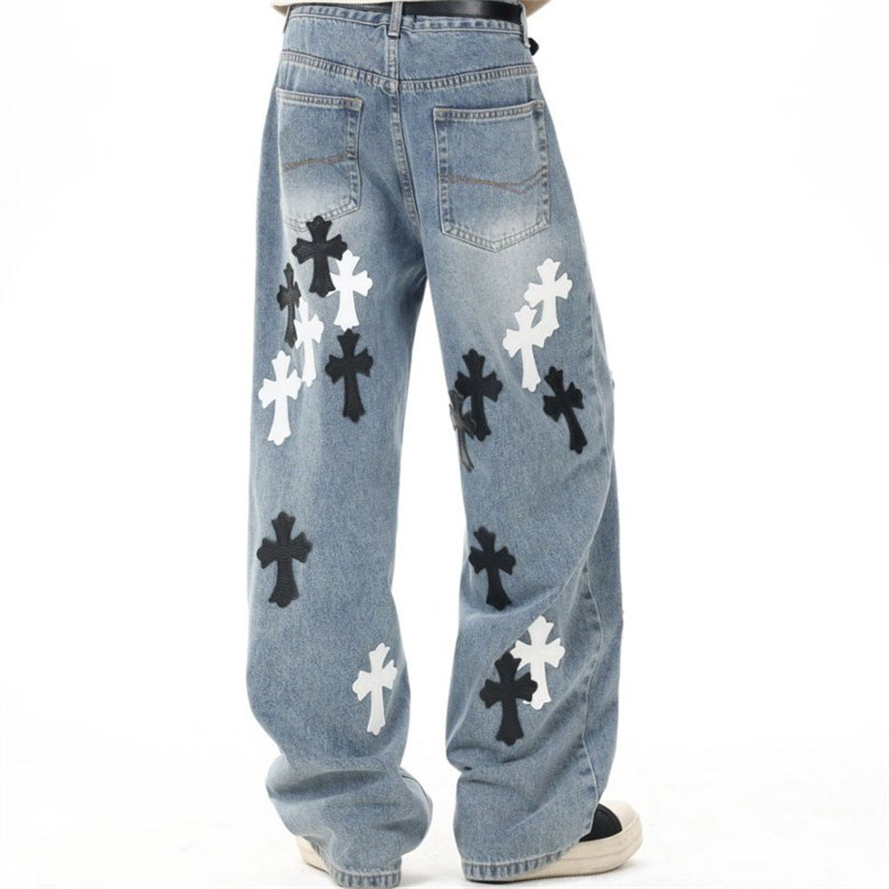 Light blue wide-leg jeans with cross patches, back view on model