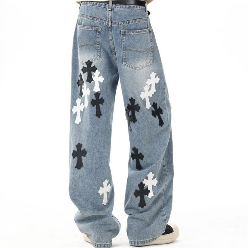 Light blue wide-leg jeans with cross patches, back view on model
