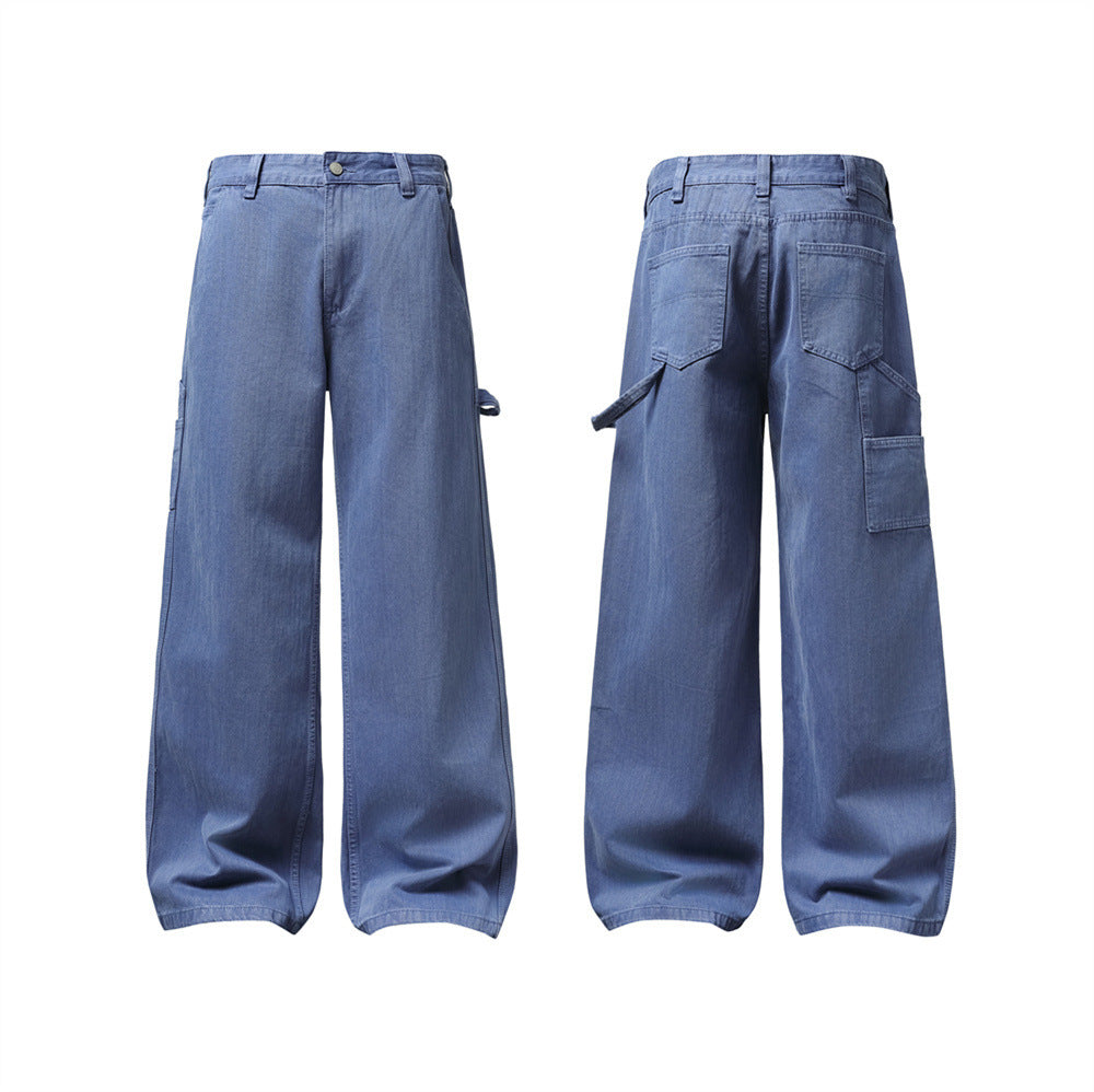 Men's wide-leg carpenter jeans in washed medium blue denim, front and back view showing utility pocket and flap pocket detail