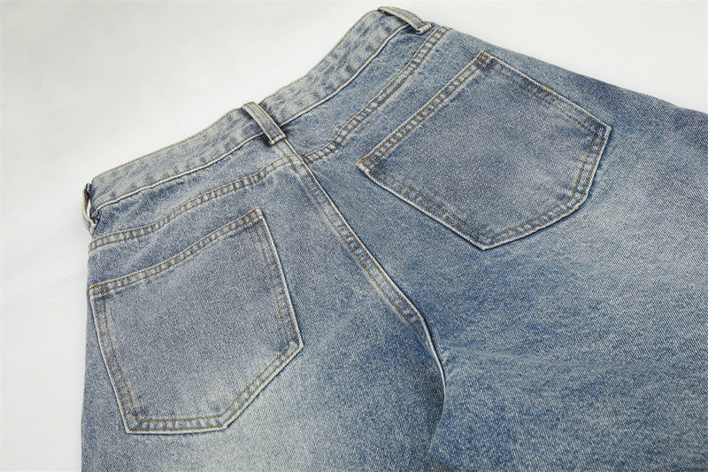 Jean large déchiré pour homme avec ornements en strass et étoiles