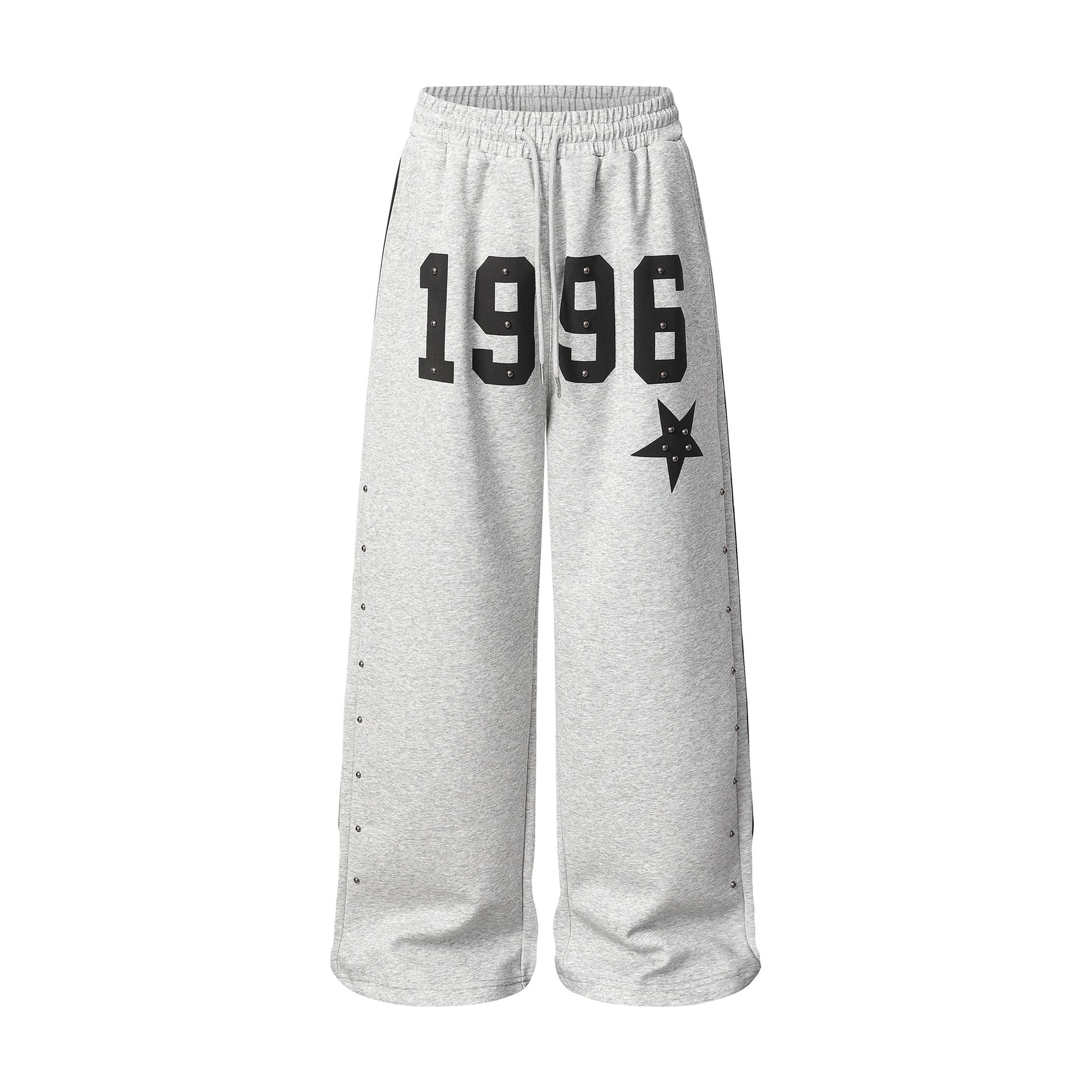 Pantalon de survêtement 1996 à jambes larges gris chiné, orné d’étoiles et de rivets métalliques, avec couture latérale à trois bandes