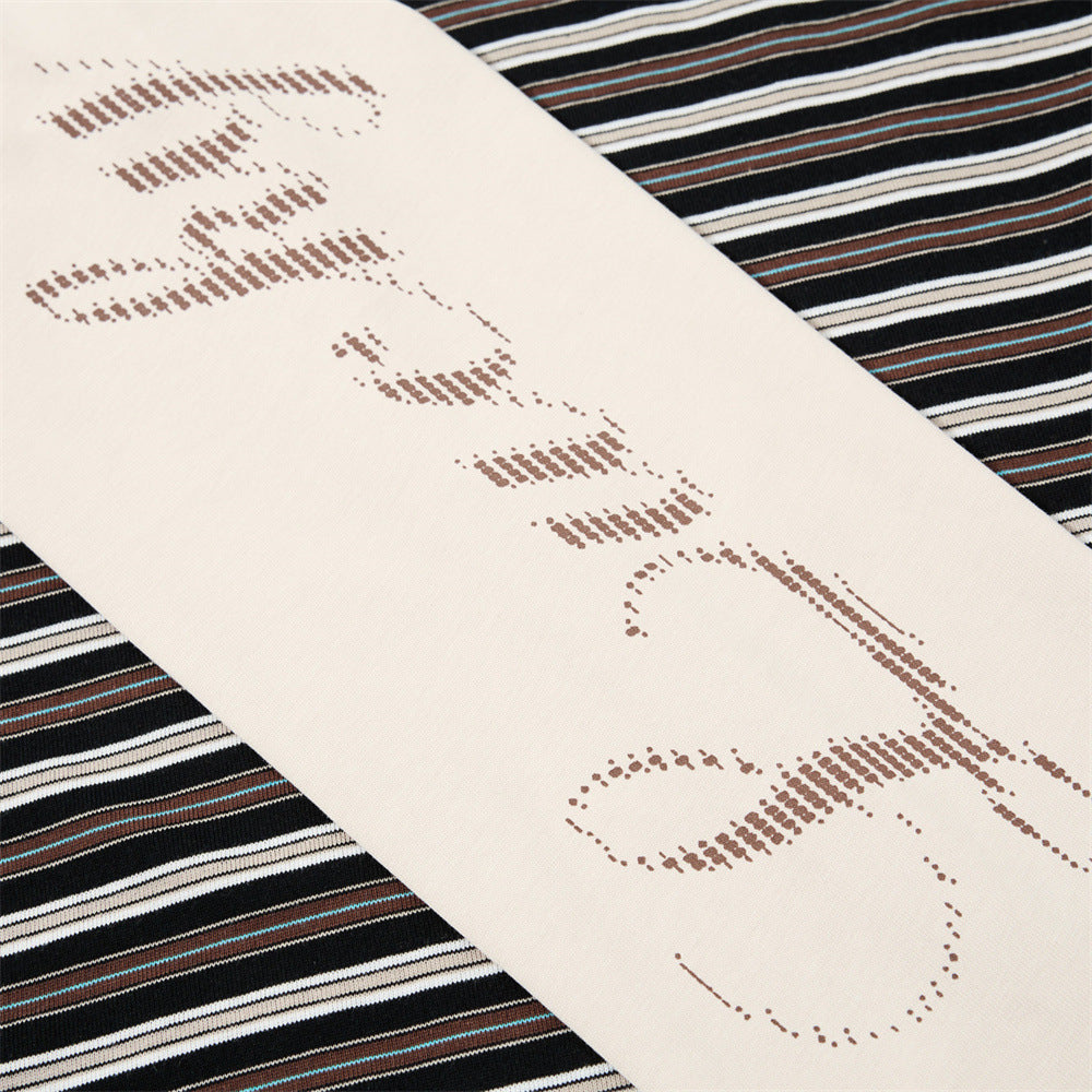 Close-up of cream sleeve with script print under black striped short sleeve