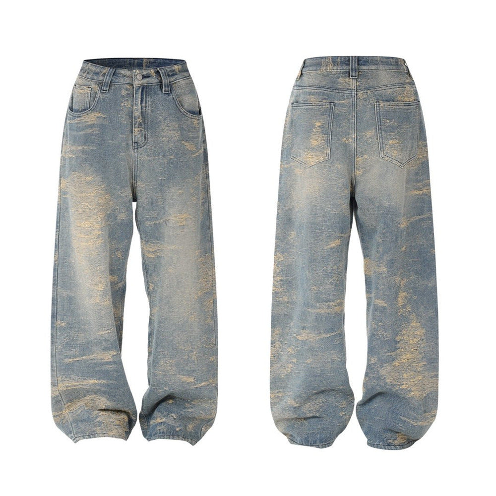 Men's vintage baggy straight-leg jeans with all-over heavy brushed distressing and golden weft texture on washed blue denim