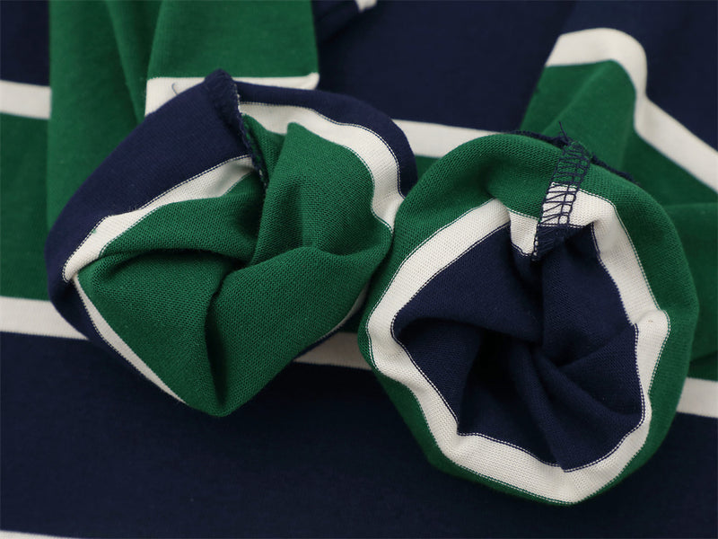 Close-up of cuff openings on striped long sleeve rugby polo shirt