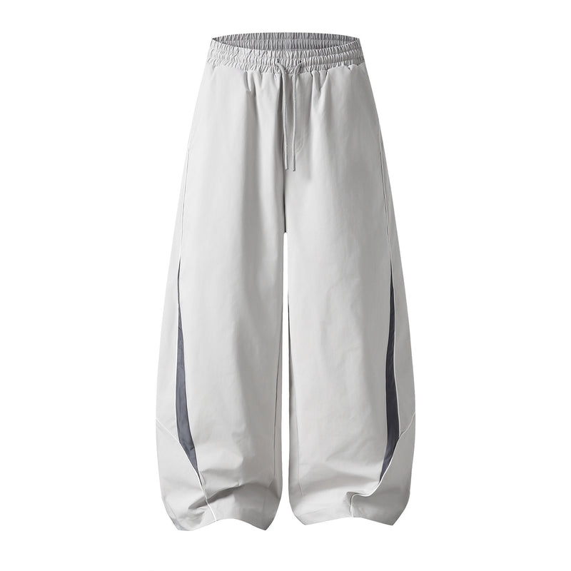 Herren-Trackpants mit kontrastierender Paspel und Colorblock-Seiteneinsätzen