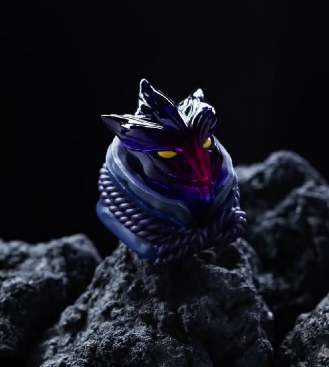 A dark, intricate Sasuke keycap by Naruto, resembling a mythical creature&