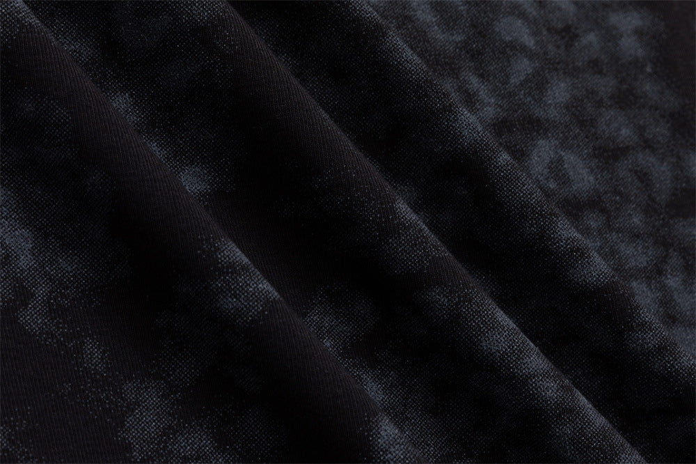 Close-up of the dark blue-black fabric showing its soft mottled pattern and fine textured surface