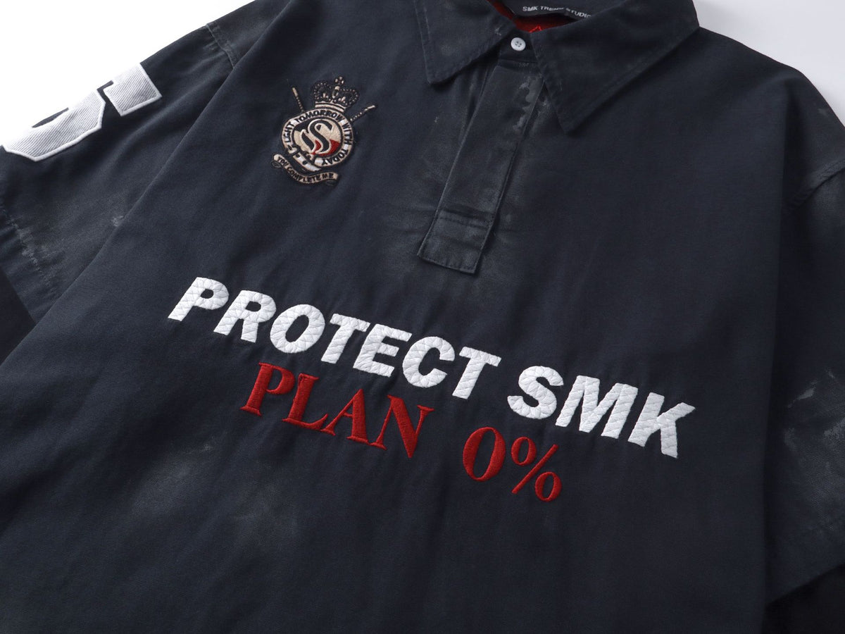 Polo de rugby oversize con lavado ácido – Mangas de falsa capa y bordado de gran tamaño