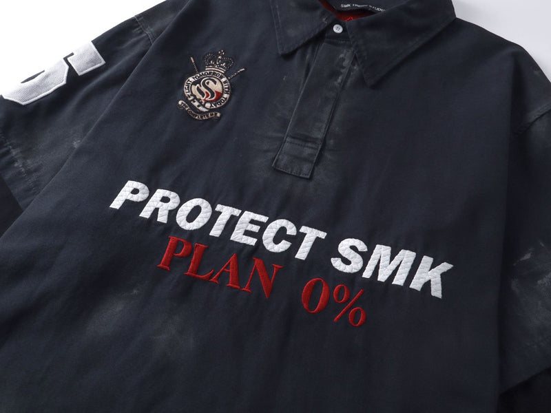Polo de rugby oversize con lavado ácido – Mangas de falsa capa y bordado de gran tamaño