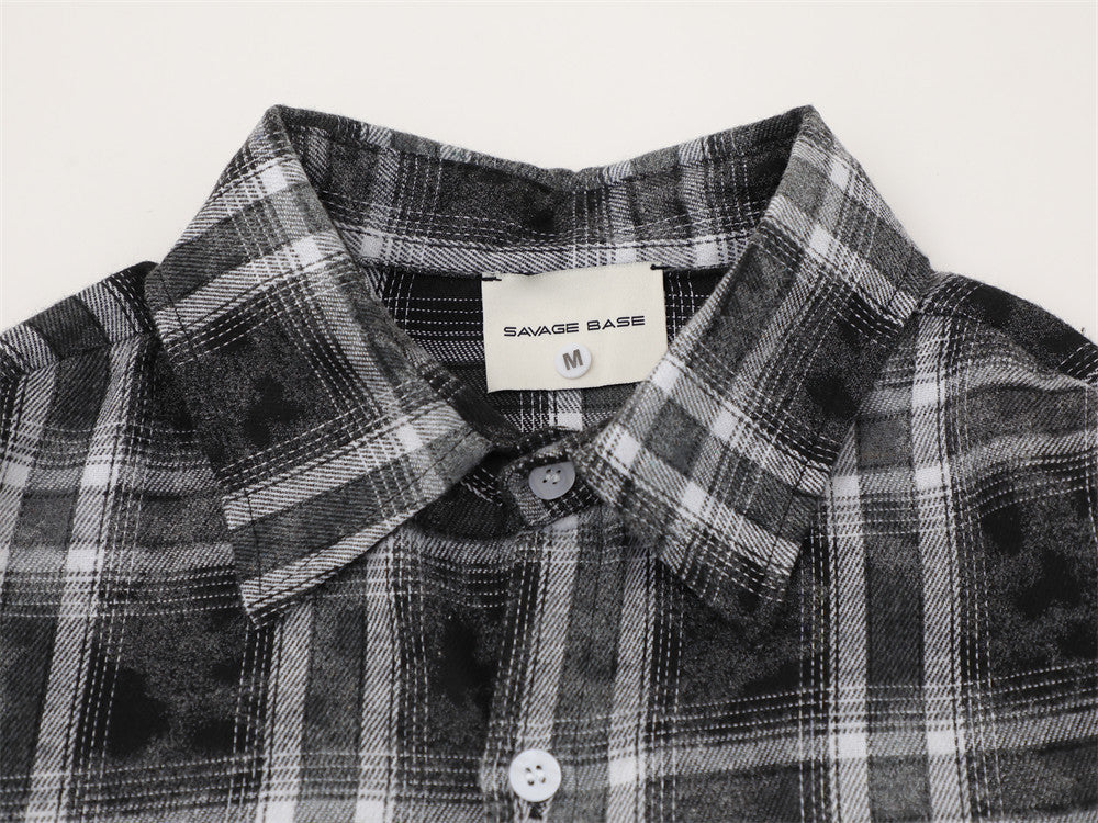 Close-up of black and white plaid flannel collar with sewn-in neck label